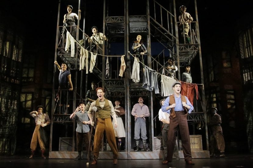 Jason Gotay as Jack, Steve Raymond as Crutchie and the cast of Disney's NEWSIES. Photo by Curtis Brown Photography.
