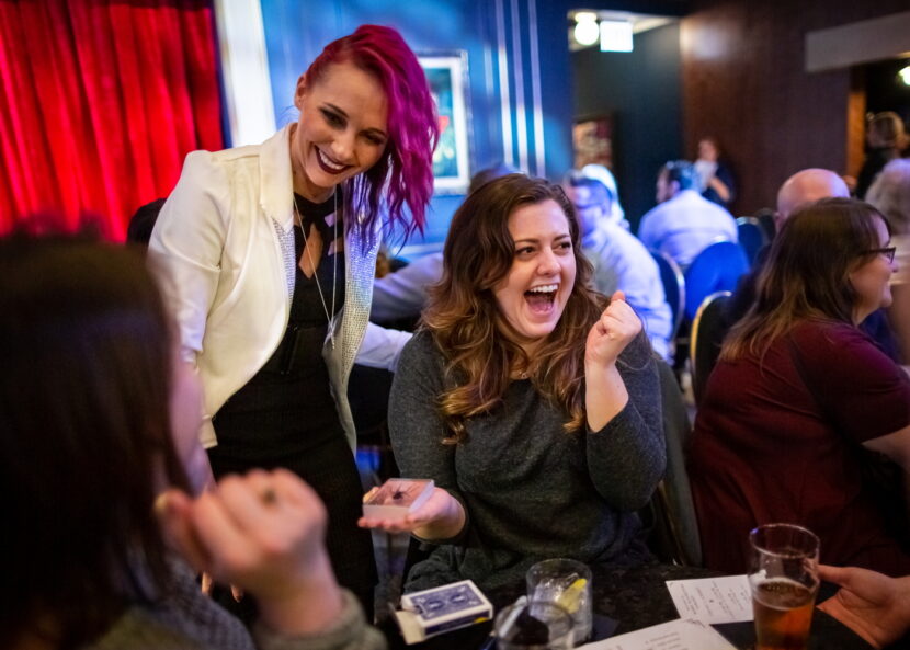 Paige Thompson performing table magic at Chicago Magic Lounge